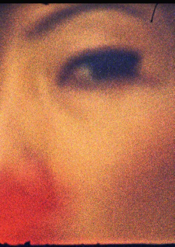 Close-up of an eye in warm tones, Super 8 film still
