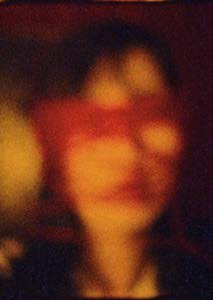 Face bound in red, Super 8 film still, second of a pair